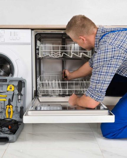 technician fixing a dishwasher repair Camden