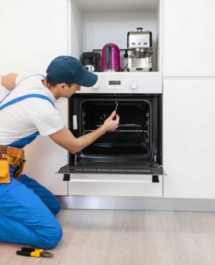 man repairing oven - About Top Appliance Repair Camden - Oven Repair Camden